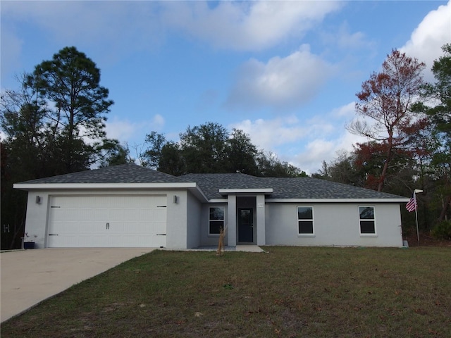 ranch-style home with a front yard and a garage