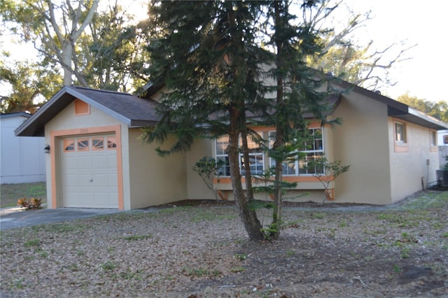 view of property exterior with a garage