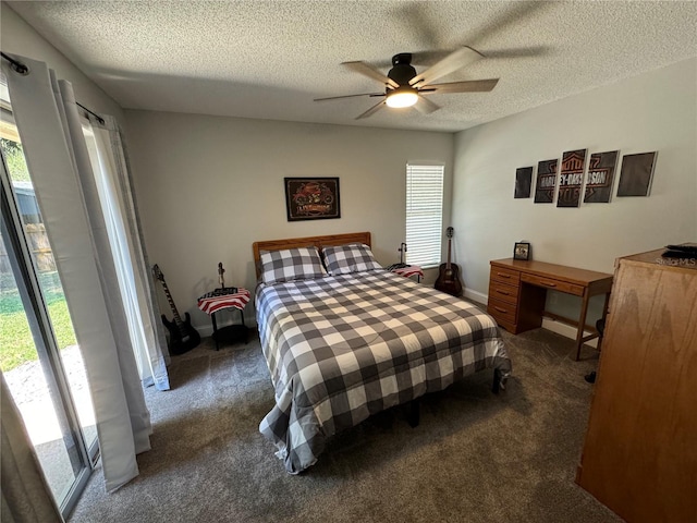 bedroom with multiple windows, dark carpet, and ceiling fan