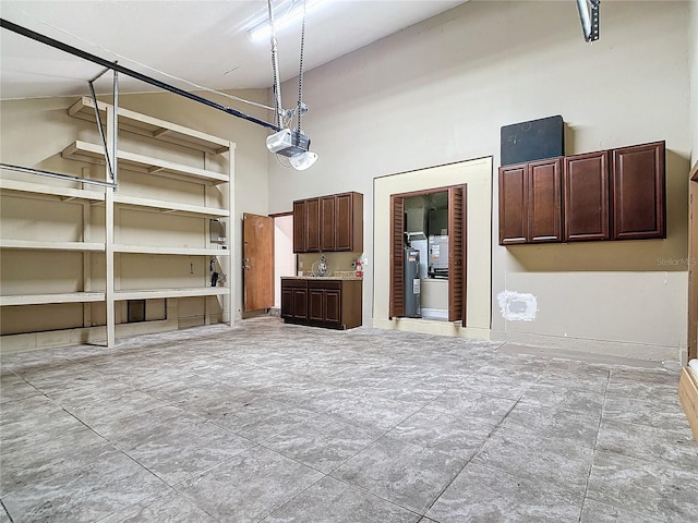 unfurnished living room featuring high vaulted ceiling and water heater