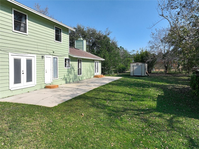 exterior space featuring a storage shed and a patio area