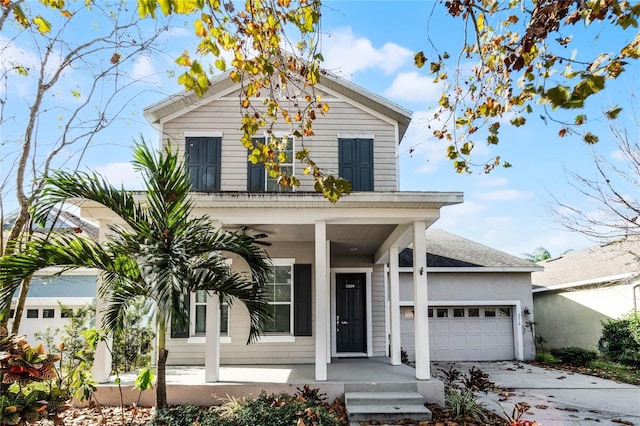 view of front of house with a porch and a garage