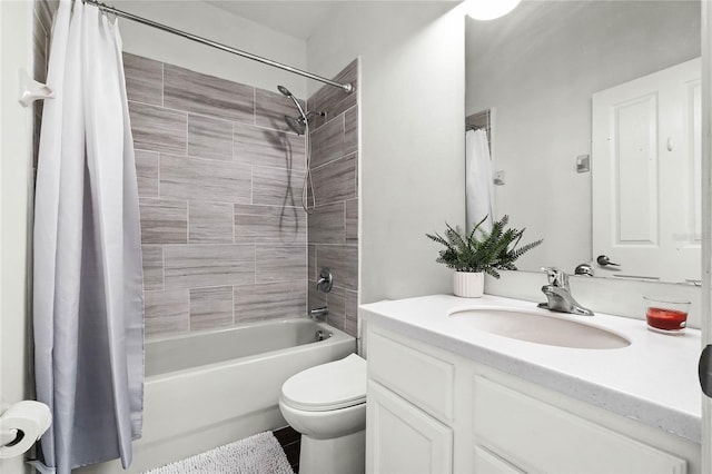 full bathroom with shower / bath combo with shower curtain, vanity, and toilet