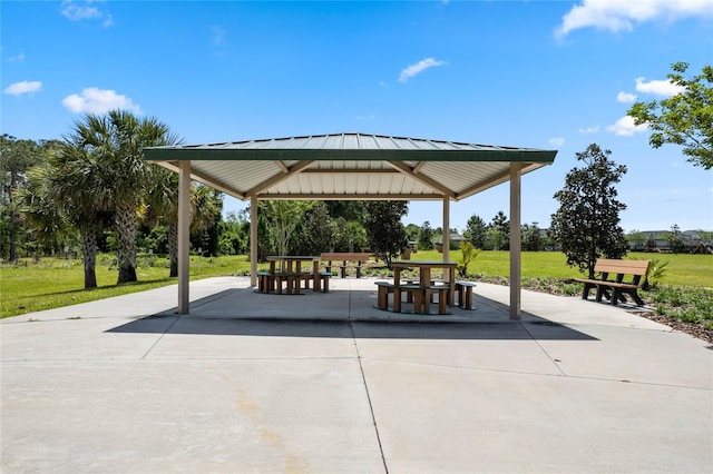 view of community with a gazebo, a patio area, and a lawn