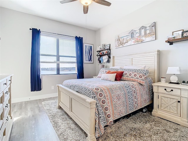 bedroom featuring light wood-type flooring and ceiling fan