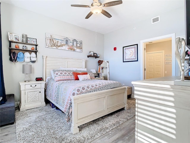 bedroom featuring ceiling fan and light hardwood / wood-style flooring