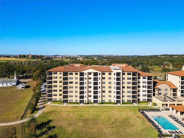 view of building exterior with a community pool