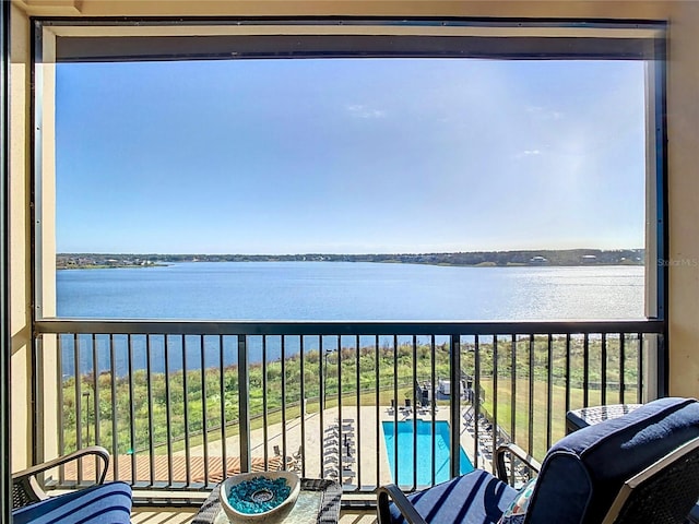 balcony featuring a water view