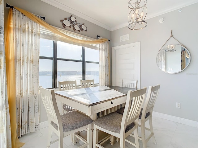 dining area with a chandelier, ornamental molding, and a water view