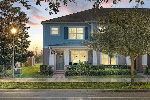 view of front of home with a lawn