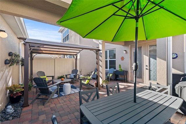 view of patio featuring french doors and a pergola