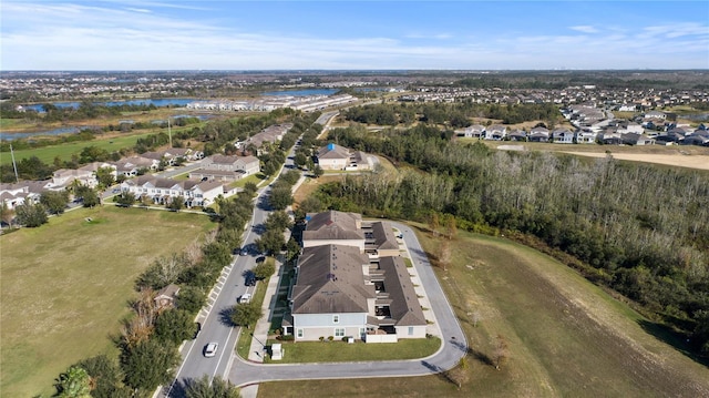 bird's eye view with a water view and a residential view