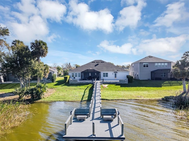 dock area featuring a yard and a water view