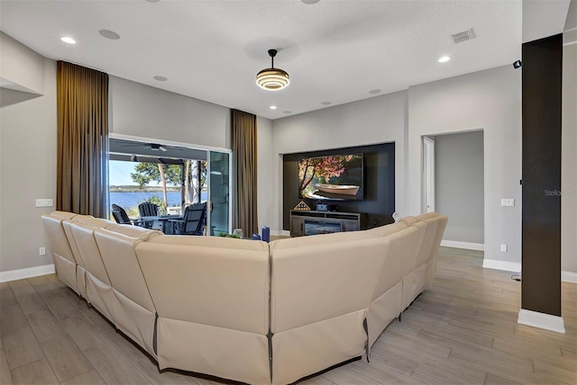 living room with a textured ceiling