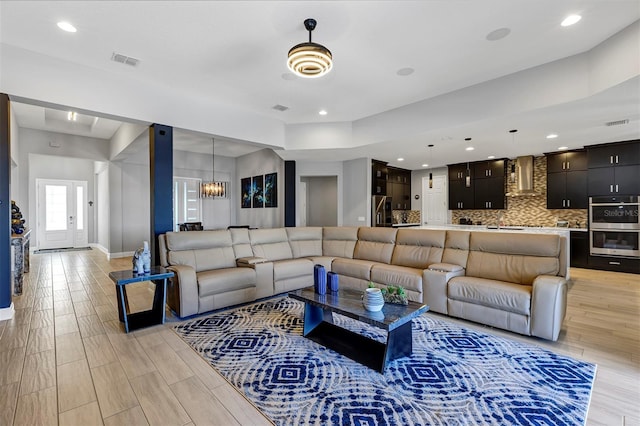 living room featuring an inviting chandelier