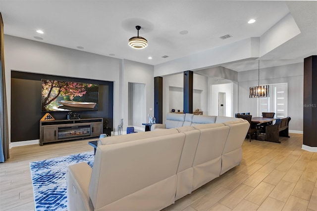 living room featuring a chandelier