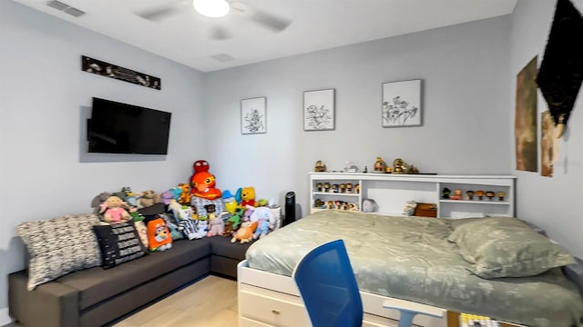 bedroom with wood-type flooring and ceiling fan