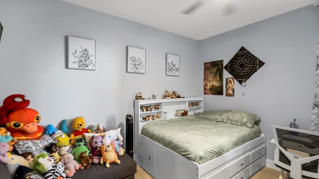 bedroom with hardwood / wood-style floors and ceiling fan