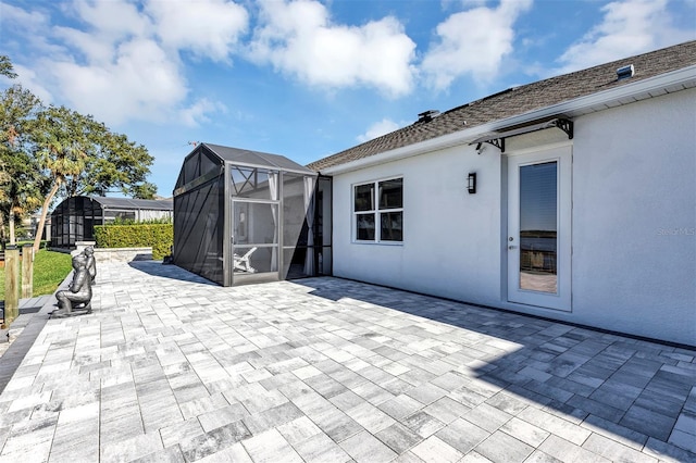 view of patio / terrace featuring a lanai