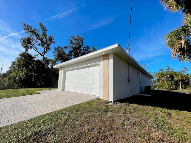 view of property exterior with stucco siding and a yard