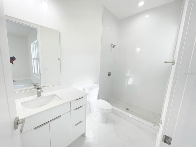 full bathroom featuring marble finish floor, vanity, a shower stall, and toilet