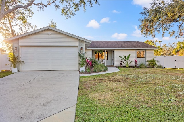 ranch-style house with a front yard and a garage