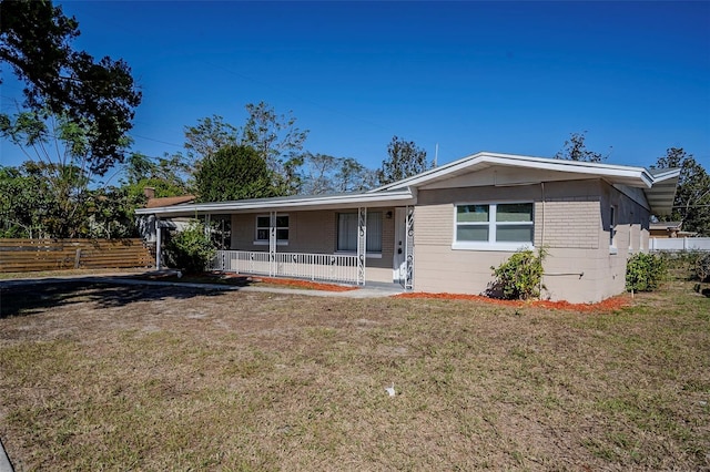 single story home with a front yard and a porch