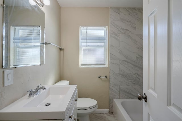 full bathroom featuring plenty of natural light, toilet, vanity, and tiled shower / bath combo