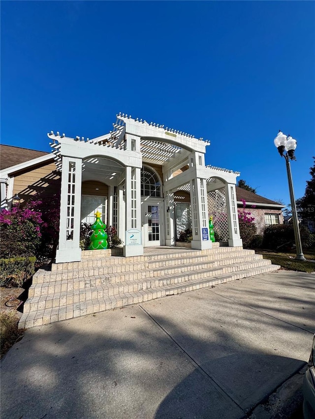 exterior space featuring a pergola