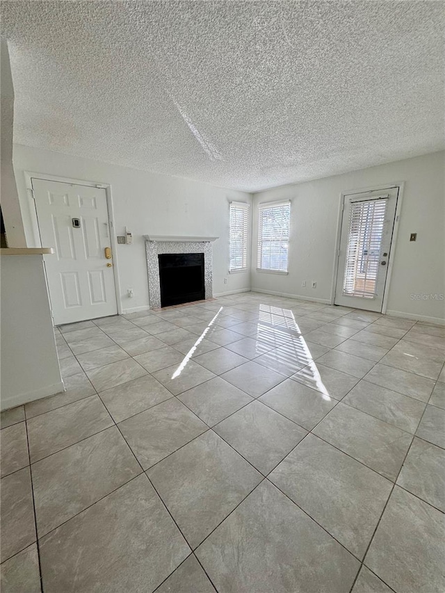 unfurnished living room with light tile patterned floors