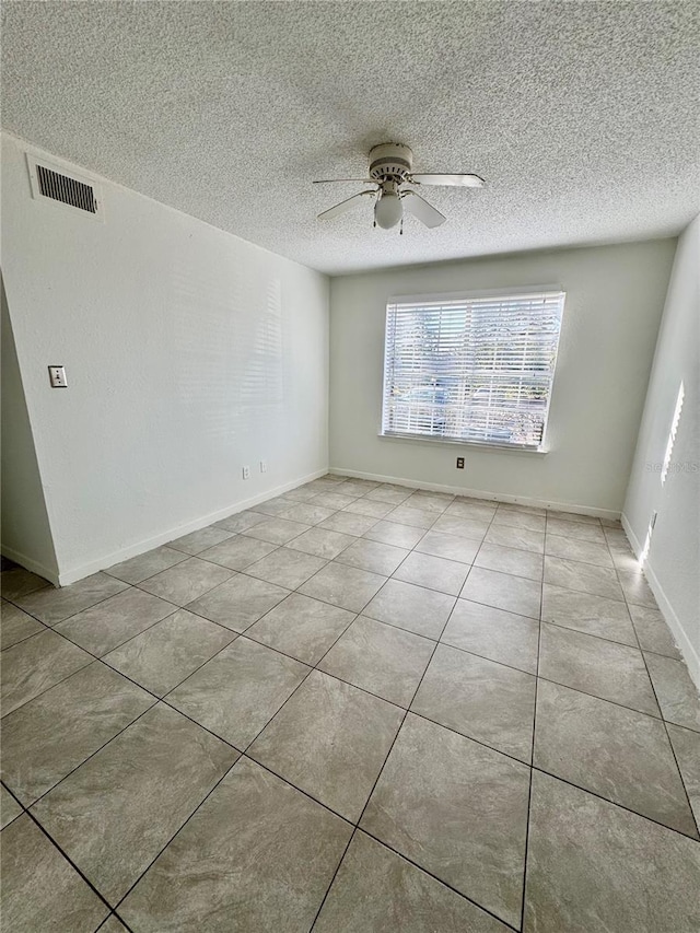 tiled empty room with ceiling fan