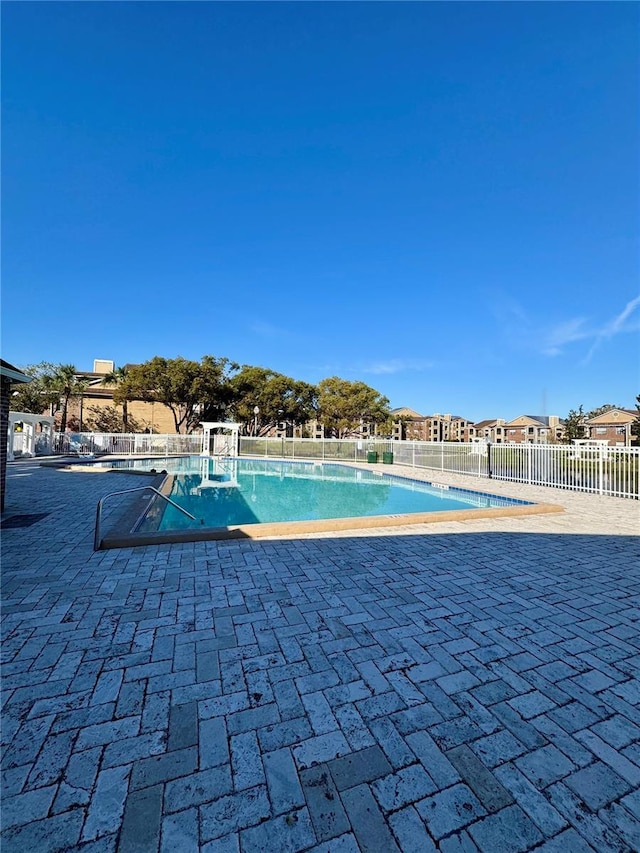 view of swimming pool with a patio