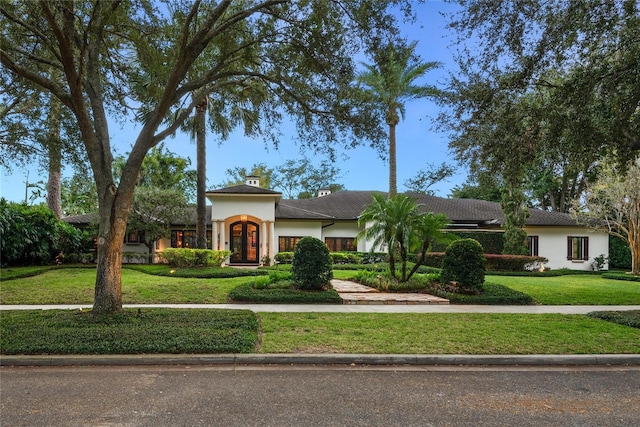 view of front of property with a front lawn