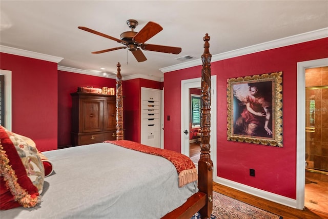 bedroom with connected bathroom, ceiling fan, crown molding, and hardwood / wood-style flooring