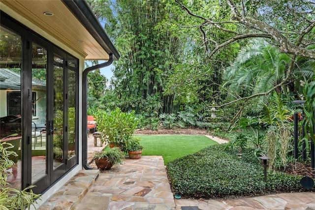 view of yard featuring french doors