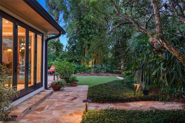 view of yard with a patio area and french doors