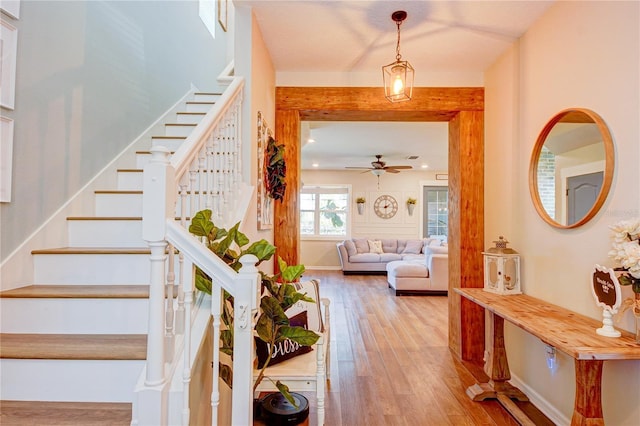 foyer entrance featuring ceiling fan and light hardwood / wood-style floors