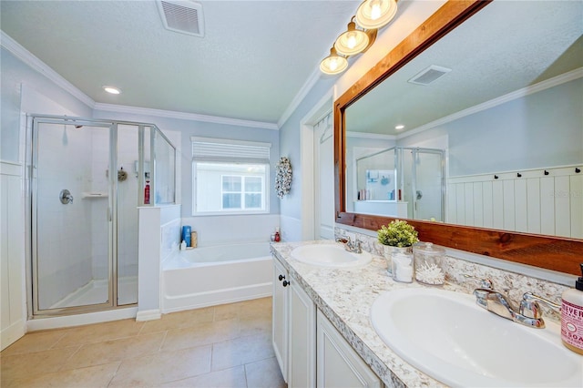 bathroom featuring ornamental molding, a textured ceiling, and independent shower and bath