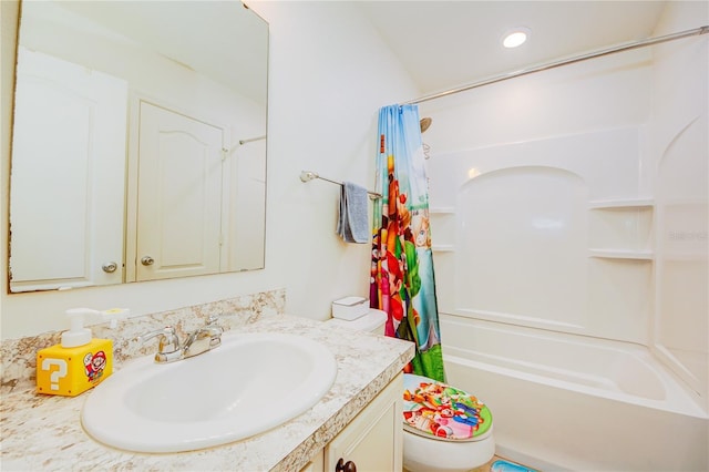 full bathroom with vanity, shower / bath combo, and toilet