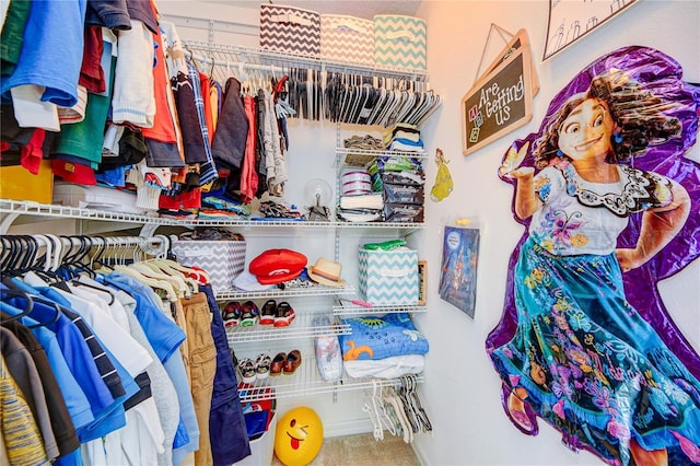 spacious closet featuring carpet floors