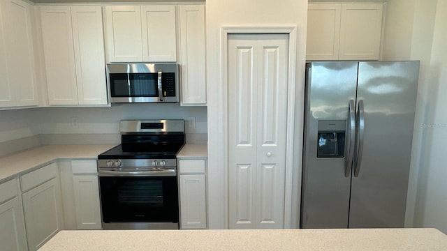 kitchen with white cabinets and stainless steel appliances