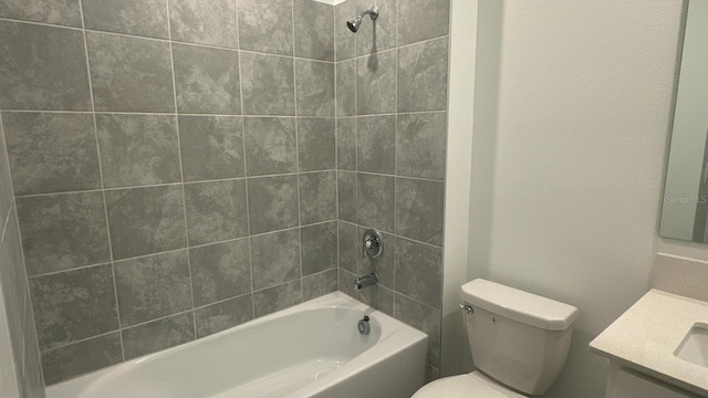 full bathroom with vanity, toilet, and tiled shower / bath