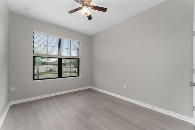 unfurnished room featuring ceiling fan and light hardwood / wood-style floors