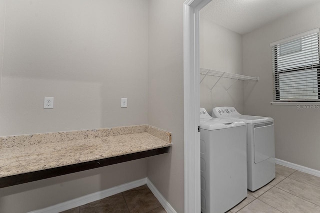 laundry room with light tile patterned floors and independent washer and dryer