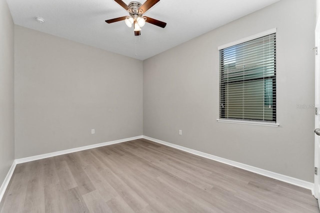 empty room featuring ceiling fan and light hardwood / wood-style flooring