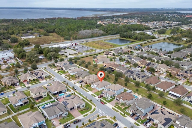 birds eye view of property featuring a water view