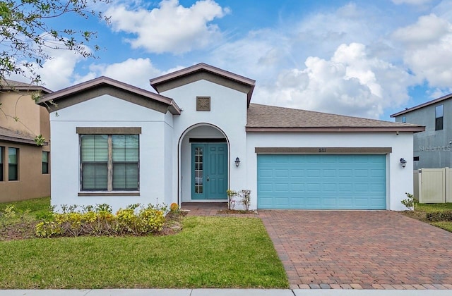 view of front of house featuring a front yard and a garage