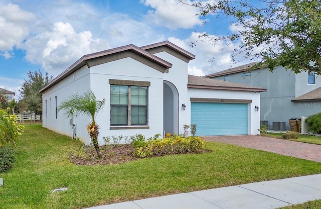 view of front of house featuring a garage and a front yard