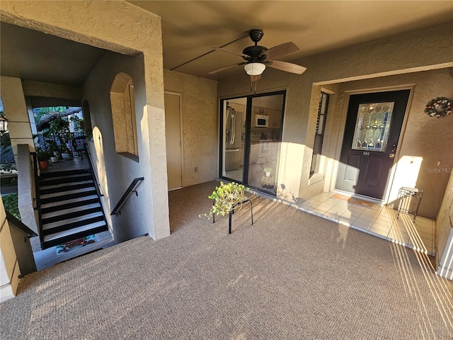 view of patio / terrace with a balcony and ceiling fan