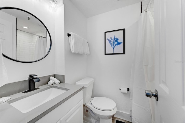 bathroom with vanity, a shower with shower curtain, and toilet